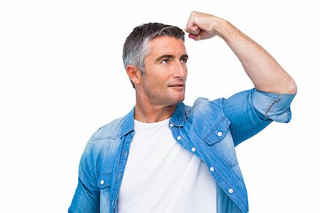 Man with grey hair tensing arm muscle on white background Stock Photo - Budget Royalty-Free & Subscription, Code: 400-07930599