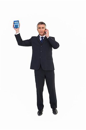 simsearch:400-06884500,k - Businessman on the phone showing a calculator on white background Stock Photo - Budget Royalty-Free & Subscription, Code: 400-07930772