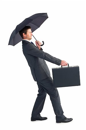 simsearch:400-08264445,k - Businessman sheltering under black umbrella on white background Stock Photo - Budget Royalty-Free & Subscription, Code: 400-07930880