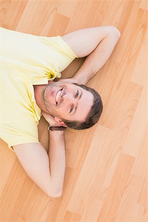 simsearch:400-07931092,k - A man lying on floor at home in the living room Foto de stock - Super Valor sin royalties y Suscripción, Código: 400-07931092