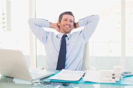 simsearch:400-07931035,k - Relaxing businessman at his desk in his office Stock Photo - Budget Royalty-Free & Subscription, Code: 400-07931136