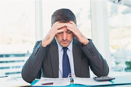 simsearch:400-07057747,k - Stressed businessman with head in hands in his office Stock Photo - Budget Royalty-Free & Subscription, Code: 400-07931166