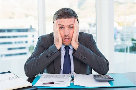 simsearch:400-07931035,k - Stressed businessman with head in hands in his office Stock Photo - Budget Royalty-Free & Subscription, Code: 400-07931167