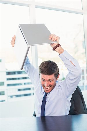 simsearch:400-08258105,k - Angry businessman throwing his laptop in his office Stock Photo - Budget Royalty-Free & Subscription, Code: 400-07931174