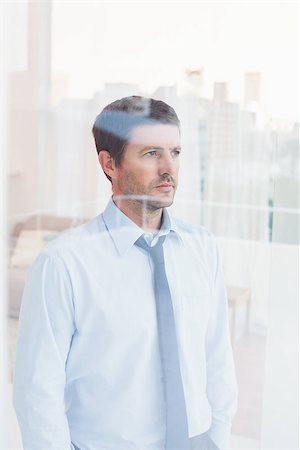 simsearch:400-07275251,k - Businessman looking out the window in his office Stock Photo - Budget Royalty-Free & Subscription, Code: 400-07931186