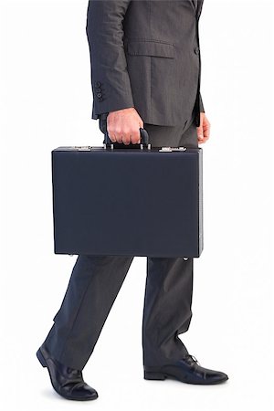 simsearch:400-08264445,k - Businessman holding briefcase walking on white background Stock Photo - Budget Royalty-Free & Subscription, Code: 400-07931206