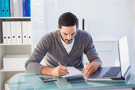 simsearch:400-07931035,k - Focused casual businessman working at his desk in the office Stock Photo - Budget Royalty-Free & Subscription, Code: 400-07931315