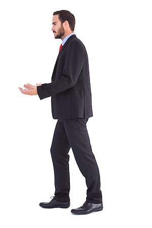 simsearch:400-08264445,k - Businessman walking and presenting with hands on white background Stock Photo - Budget Royalty-Free & Subscription, Code: 400-07931398