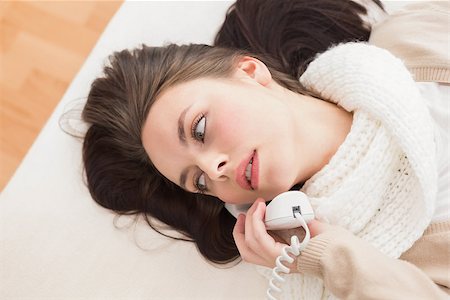 Pretty brunette making a phone call on bed at home in the bedroom Stock Photo - Budget Royalty-Free & Subscription, Code: 400-07931573