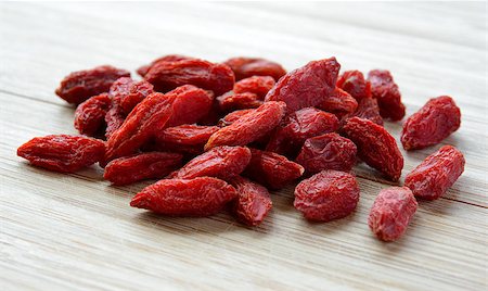 simsearch:400-07545974,k - Heap of Dry Goji Berries on the Wooden Table. Healthy Diet Stock Photo - Budget Royalty-Free & Subscription, Code: 400-07932772