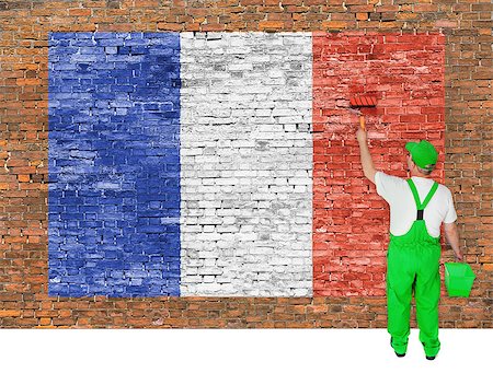 simsearch:400-08403526,k - House painter covers old brick wall with flag of France Fotografie stock - Microstock e Abbonamento, Codice: 400-07932787