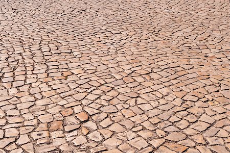 Receding cobblestone ground pattern texture background. Fotografie stock - Microstock e Abbonamento, Codice: 400-07932799