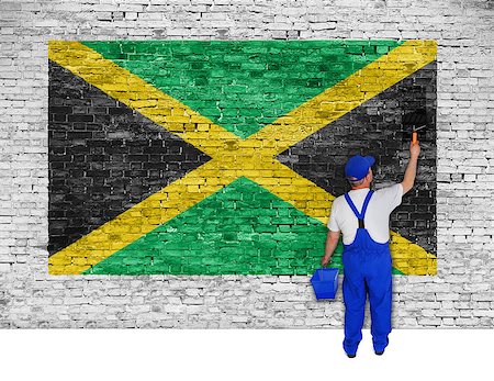 simsearch:400-08403526,k - House painter covers white brick wall with flag of Jamaica Fotografie stock - Microstock e Abbonamento, Codice: 400-07932808