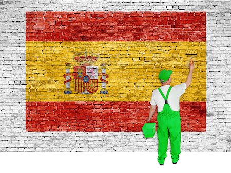 simsearch:400-08403526,k - House painter paints flag of Spain on white brick wall Fotografie stock - Microstock e Abbonamento, Codice: 400-07933542