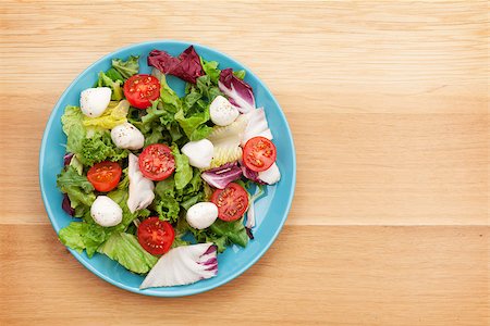simsearch:400-06485512,k - Fresh healthy salad on wooden table with copy space Stock Photo - Budget Royalty-Free & Subscription, Code: 400-07933676