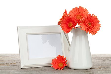 simsearch:400-07662543,k - Orange gerbera flowers and photo frame on wooden table on white background Stock Photo - Budget Royalty-Free & Subscription, Code: 400-07933681