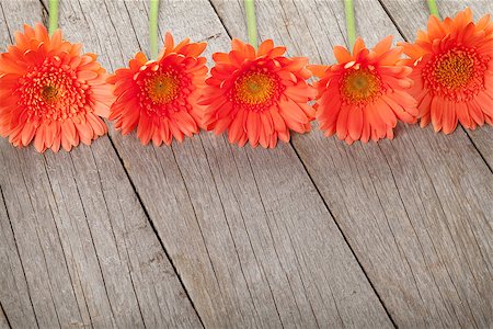 simsearch:400-07662543,k - Wooden background with orange gerbera flowers and copy space Stock Photo - Budget Royalty-Free & Subscription, Code: 400-07933683