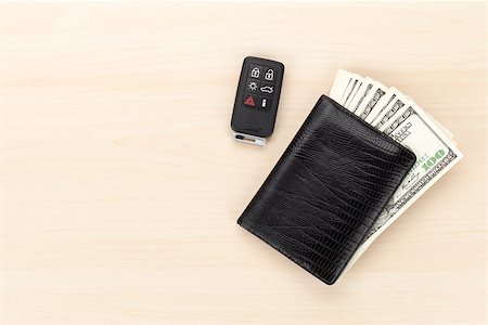 simsearch:400-07915276,k - Money cash wallet and car remote key on wooden table. View from above with copy space Photographie de stock - Aubaine LD & Abonnement, Code: 400-07933735