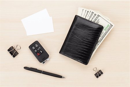 simsearch:400-07915276,k - Money cash wallet and car remote key on wooden table. View from above with business cards for copy space Photographie de stock - Aubaine LD & Abonnement, Code: 400-07933733