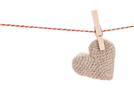 Valentines day toy heart hanging on rope. Isolated on white background Foto de stock - Super Valor sin royalties y Suscripción, Código: 400-07933759