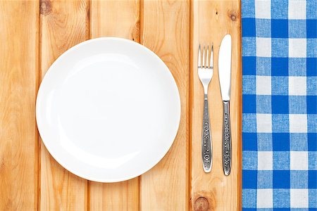 restaurant in blue with table setting - Empty plate, silverware and towel over wooden table background. View from above with copy space Stock Photo - Budget Royalty-Free & Subscription, Code: 400-07933776