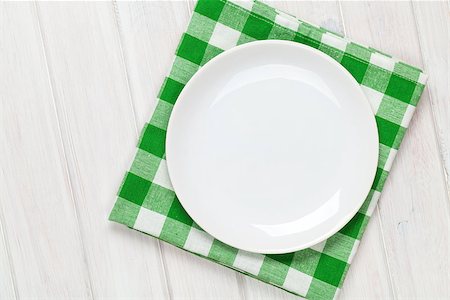 simsearch:400-04895787,k - Empty plate and towel over wooden table background. View from above with copy space Stock Photo - Budget Royalty-Free & Subscription, Code: 400-07933779
