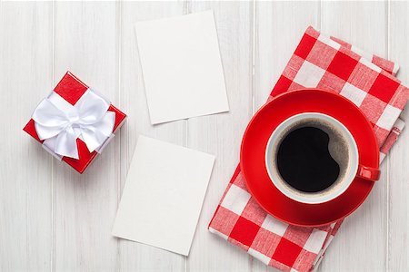 simsearch:400-07662543,k - Valentines day blank photo frames, coffee cup and gift box over white wooden table Stock Photo - Budget Royalty-Free & Subscription, Code: 400-07933786