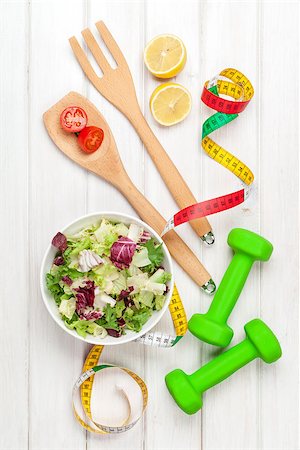 simsearch:400-07754604,k - Dumbells, tape measure and healthy food. Fitness and health. View from above over wooden table Fotografie stock - Microstock e Abbonamento, Codice: 400-07933783