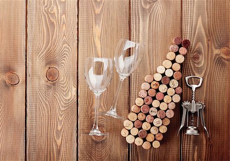 simsearch:400-07937813,k - Wine bottle shaped corks, glasses and corkscrew over rustic wooden table background. View from above with copy space Photographie de stock - Aubaine LD & Abonnement, Code: 400-07933829