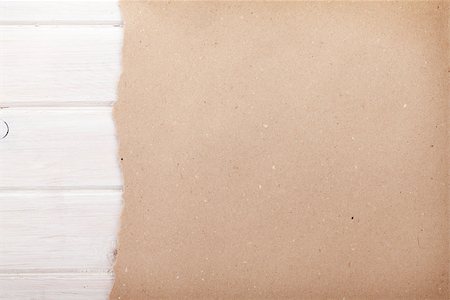 Cardboard paper over white wood background with copy space Stock Photo - Budget Royalty-Free & Subscription, Code: 400-07933823