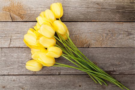 simsearch:400-08036453,k - Fresh yellow tulips bouquet over wooden table background with copy space Stock Photo - Budget Royalty-Free & Subscription, Code: 400-07933846