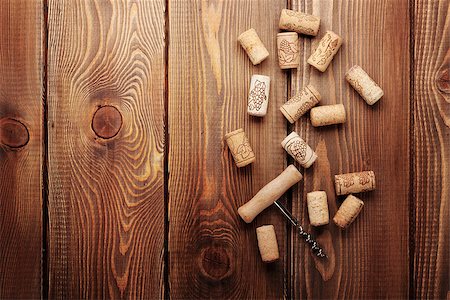 simsearch:400-07933837,k - Wine corks and corkscrew over rustic wooden table background. View from above with copy space Stockbilder - Microstock & Abonnement, Bildnummer: 400-07933848