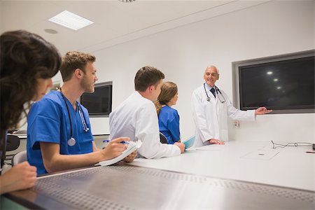 school biology - Medical professor teaching young students at the university Stock Photo - Budget Royalty-Free & Subscription, Code: 400-07940041