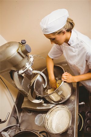 simsearch:6109-07601113,k - Baker using large mixer to mix dough in a commercial kitchen Stock Photo - Budget Royalty-Free & Subscription, Code: 400-07940639