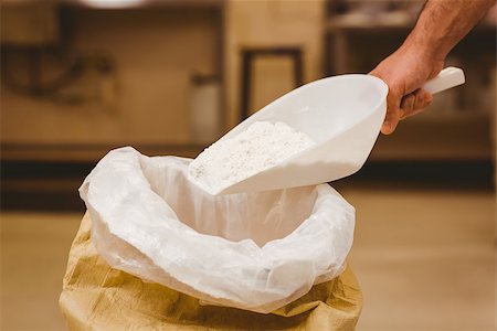 sack flour - Baker scooping flour out of sack in a commercial kitchen Stock Photo - Budget Royalty-Free & Subscription, Code: 400-07940632