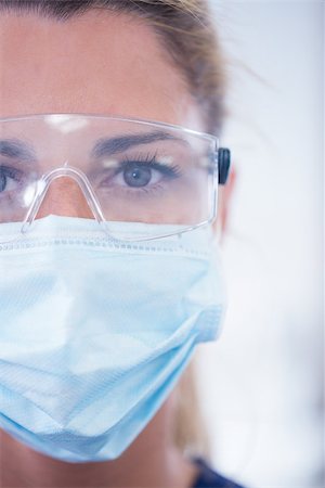 simsearch:400-07940798,k - Close up of a dentist in mask looking at camera at the dental clinic Stock Photo - Budget Royalty-Free & Subscription, Code: 400-07940802