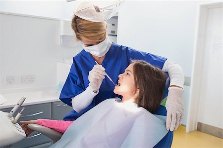simsearch:400-07684901,k - Pediatric dentist examining her young patient in dental clinic Stock Photo - Budget Royalty-Free & Subscription, Code: 400-07941379