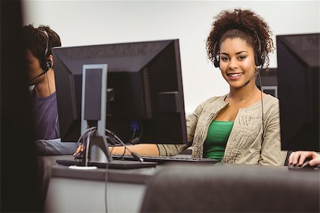 simsearch:400-07267978,k - Student wearing headset looking at camera at the university Stock Photo - Budget Royalty-Free & Subscription, Code: 400-07941811