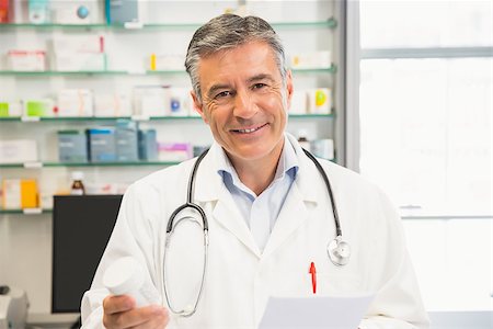 pharmacist (male) - Happy pharmacist smiling at camera at the hospital pharmacy Stock Photo - Budget Royalty-Free & Subscription, Code: 400-07942010