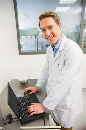 simsearch:6109-08537870,k - Focused pharmacist using his laptop at the hospital pharmacy Stock Photo - Budget Royalty-Free & Subscription, Code: 400-07942042