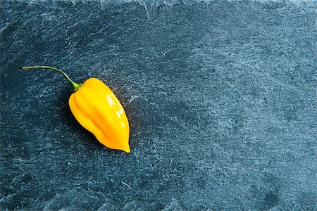 Closeup on yellow chili pepper on stone substrate Stock Photo - Budget Royalty-Free & Subscription, Code: 400-07954053