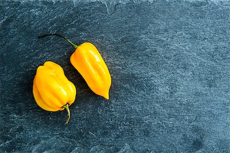 Closeup on yellow chili peppers on stone substrate Stock Photo - Budget Royalty-Free & Subscription, Code: 400-07954068