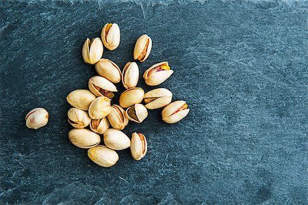 Closeup on pistachio on stone substrate Stock Photo - Budget Royalty-Free & Subscription, Code: 400-07954063