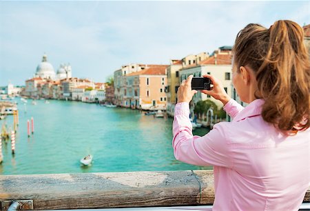 piccolo - Young woman standing on bridge with grand canal view in venice, italy and taking photo. rear view Stock Photo - Budget Royalty-Free & Subscription, Code: 400-07954294