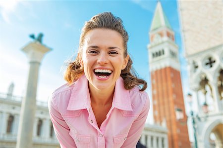 simsearch:400-07954318,k - Portrait of happy young woman against campanile di san marco in venice, italy Stock Photo - Budget Royalty-Free & Subscription, Code: 400-07954307