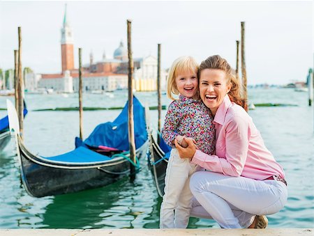 simsearch:400-08134697,k - Portrait of happy mother and baby on grand canal embankment in venice, italy Stock Photo - Budget Royalty-Free & Subscription, Code: 400-07954325