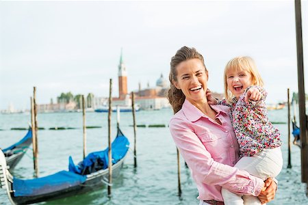simsearch:400-07954318,k - Portrait of happy mother and baby on grand canal embankment in venice, italy Stock Photo - Budget Royalty-Free & Subscription, Code: 400-07954335