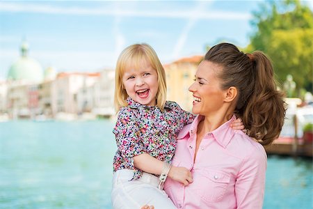 simsearch:400-08134687,k - Portrait of happy mother and baby standing on grand canal embankment in venice, italy Stock Photo - Budget Royalty-Free & Subscription, Code: 400-07954338