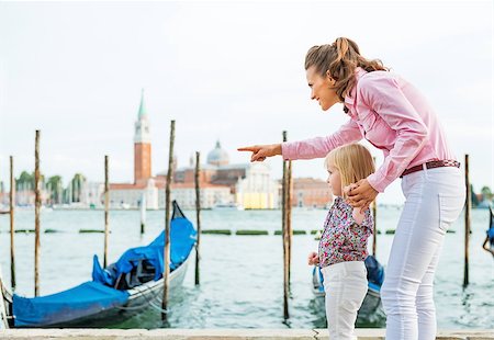 simsearch:400-08134697,k - Mother pointing baby on something on grand canal embankment in venice, italy Stock Photo - Budget Royalty-Free & Subscription, Code: 400-07954332