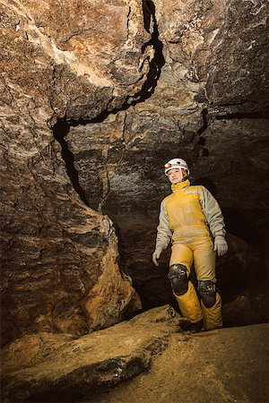 simsearch:625-01752773,k - Young female caver exploring the cave. Mlynky Cave, Ukraine Stock Photo - Budget Royalty-Free & Subscription, Code: 400-07955006